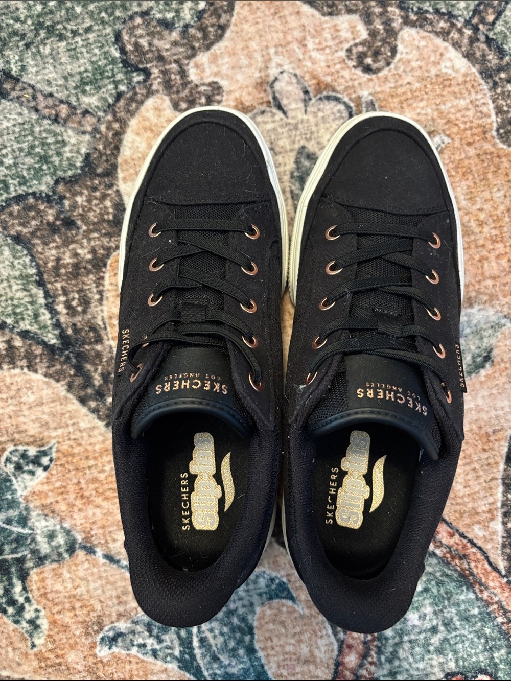 Skechers Womenβs Black Canvas Low-Top Sneakers with Gold Accents